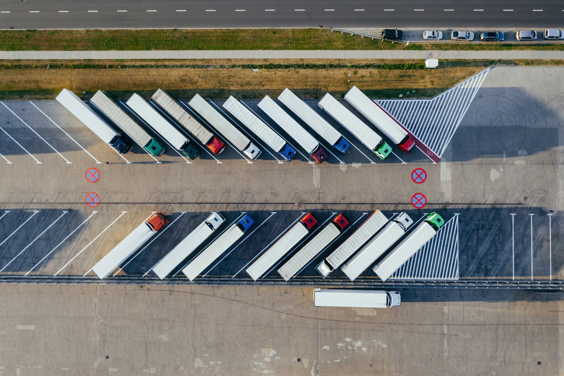 Freight vehicles aligned in a distribution yard